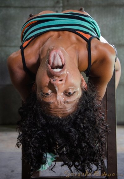 Blindfolded ebony girl Lotus Lain tied to chair for forced deepthroat & facial Gallery Cover Image