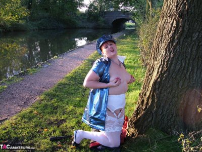 Overweight mature redhead Valgasmic Exposed exposes herself on canal path Gallery Cover Image