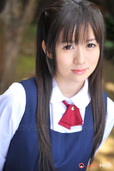 Charming Japanese babe posing in her cute school outfit in the garden Gallery Cover Image